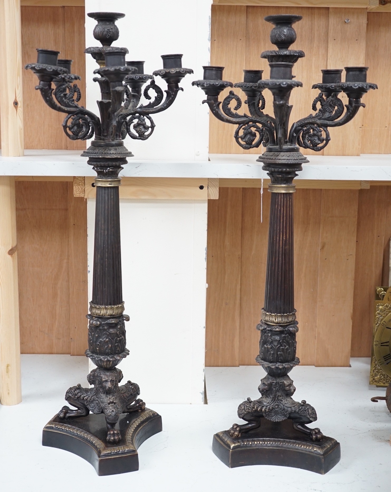 A pair of Empire style bronze candelabra, 71cm tall